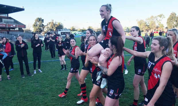 WReport16_webhero.jpg Tash Hardy is chaired off after her final game in the red and black.